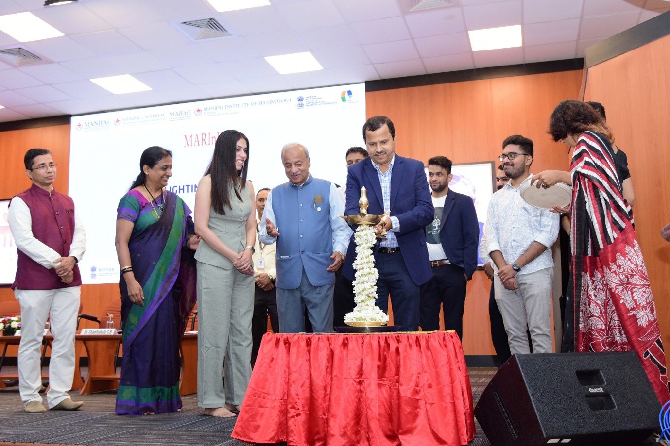 Mr. Praveen Kumar Kalbhavi, MD & CEO, Novigo Solutions, and other dignitaries, lighting the ceremonial lamp to mark the launch of MARInE.ai
